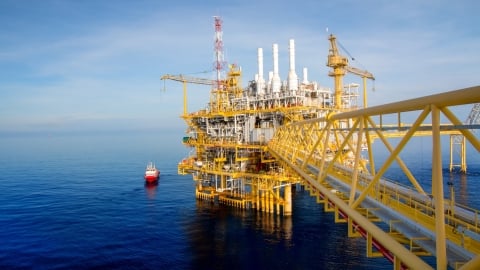 boat attending to offshore rig